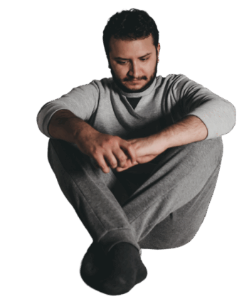 The man sitting on the floor, feeling depressed