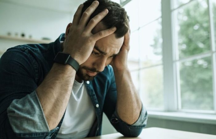 A man feeling sad and overwhelmed